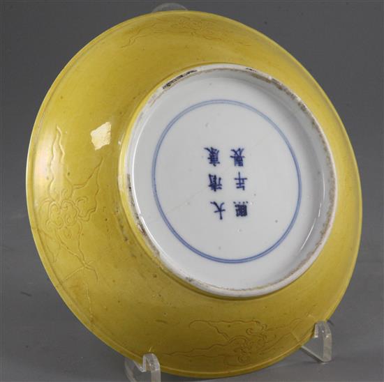 A Chinese sgraffito yellow glazed dragon dish